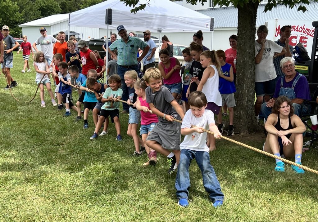 Children compete in the tug-o-war.