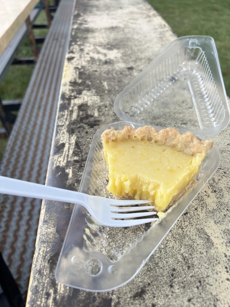 A slice of lemon pie sits half eaten at the Vinland Fair.