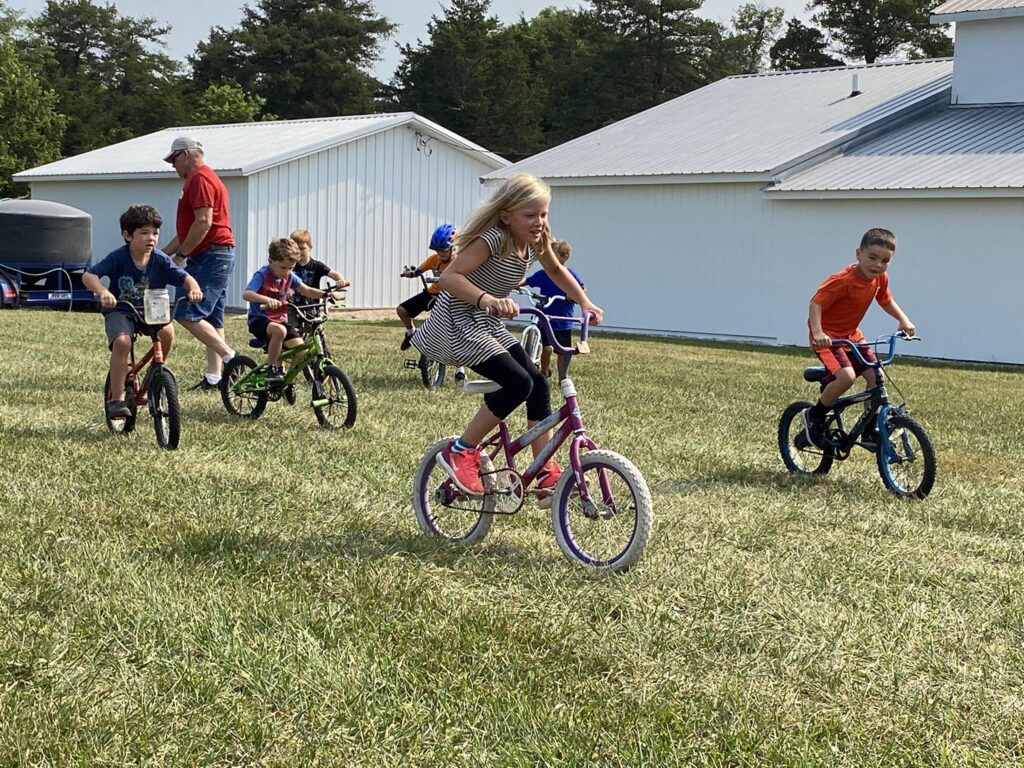 Children participate in bicycle races.